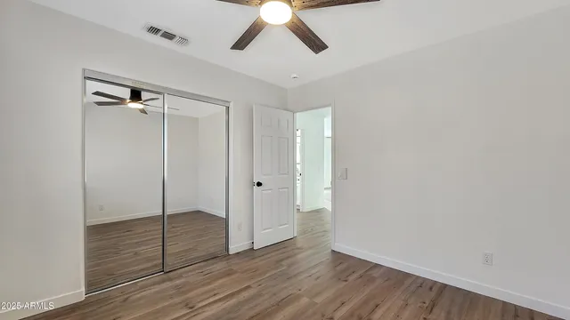 a view of entryway with wooden floor