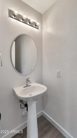 a bathroom with a sink and mirror