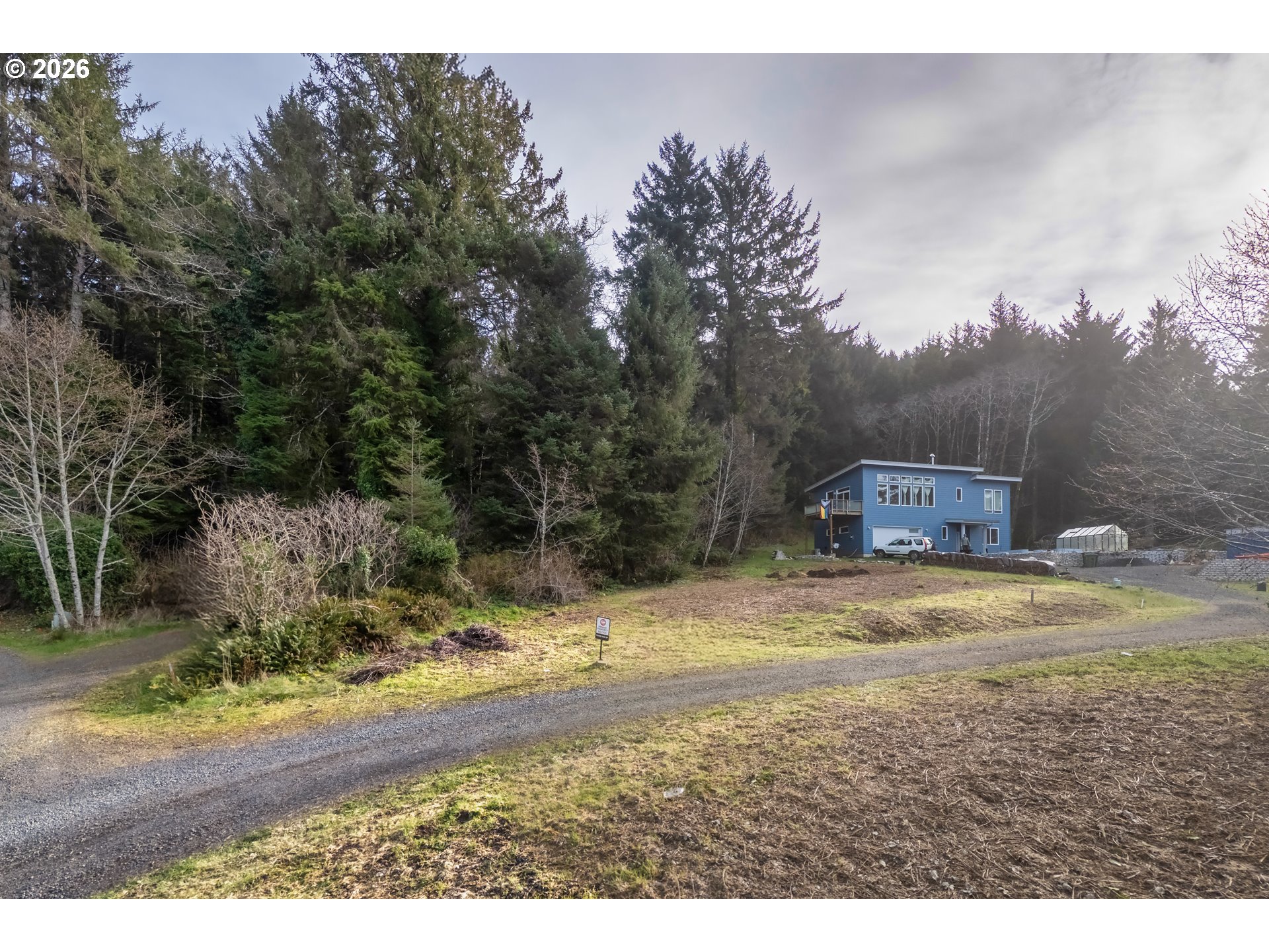 30 Cape Ranch Road Yachats, OR 97498 - Photo 3 of 20 a view of a yard with a tree