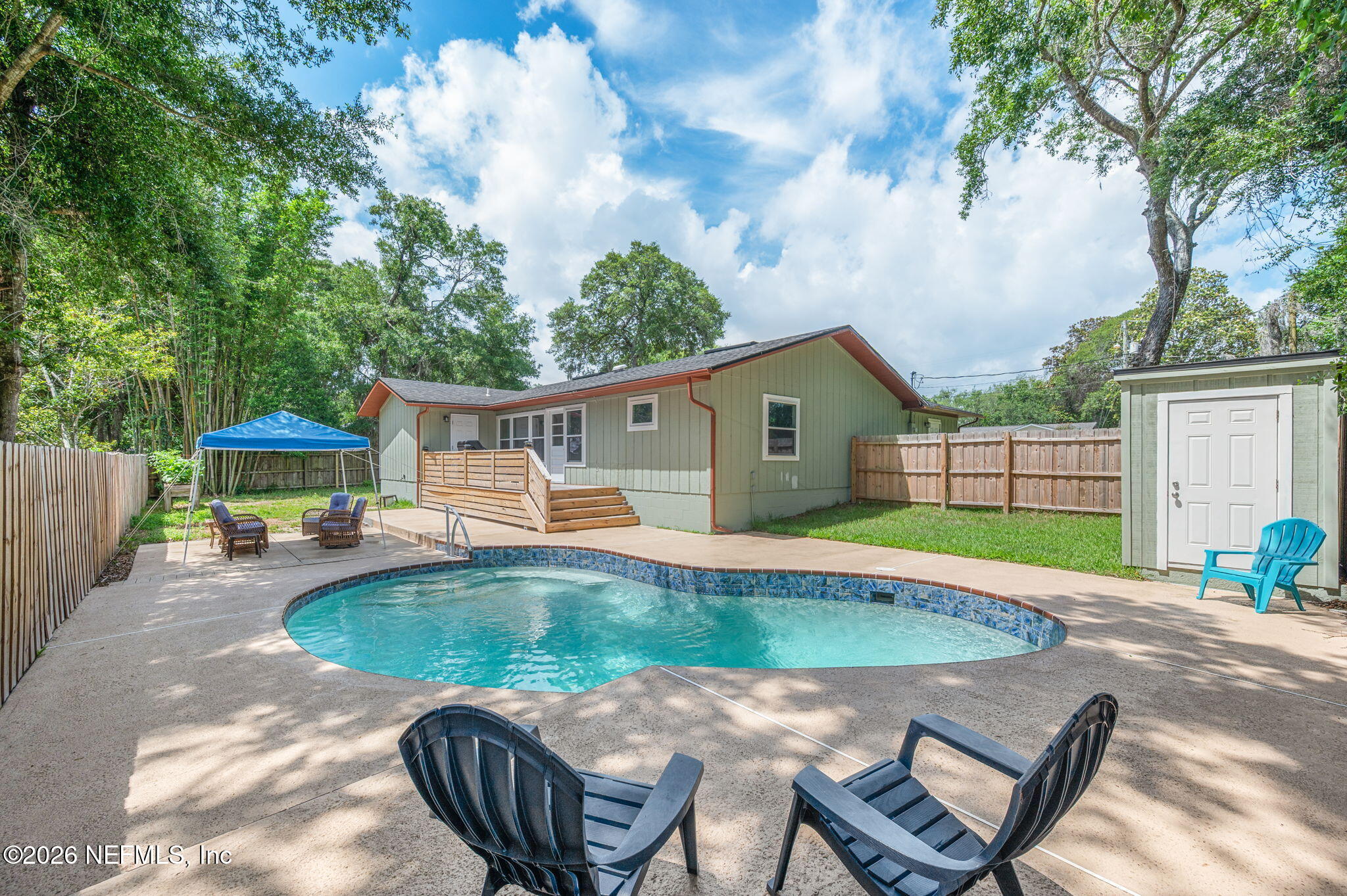 507 Gentian Road St. Augustine, FL 32086 - Photo 20 of 82 a view of a house with backyard and sitting area