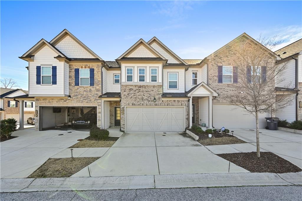 1102 Lossie Lane Grayson, GA 30017 - Photo 2 of 34 a front view of a house with yard