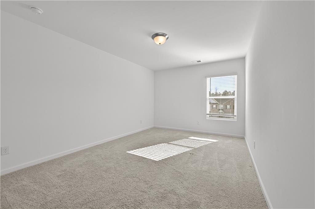 1102 Lossie Lane Grayson, GA 30017 - Photo 21 of 34 an empty room with windows