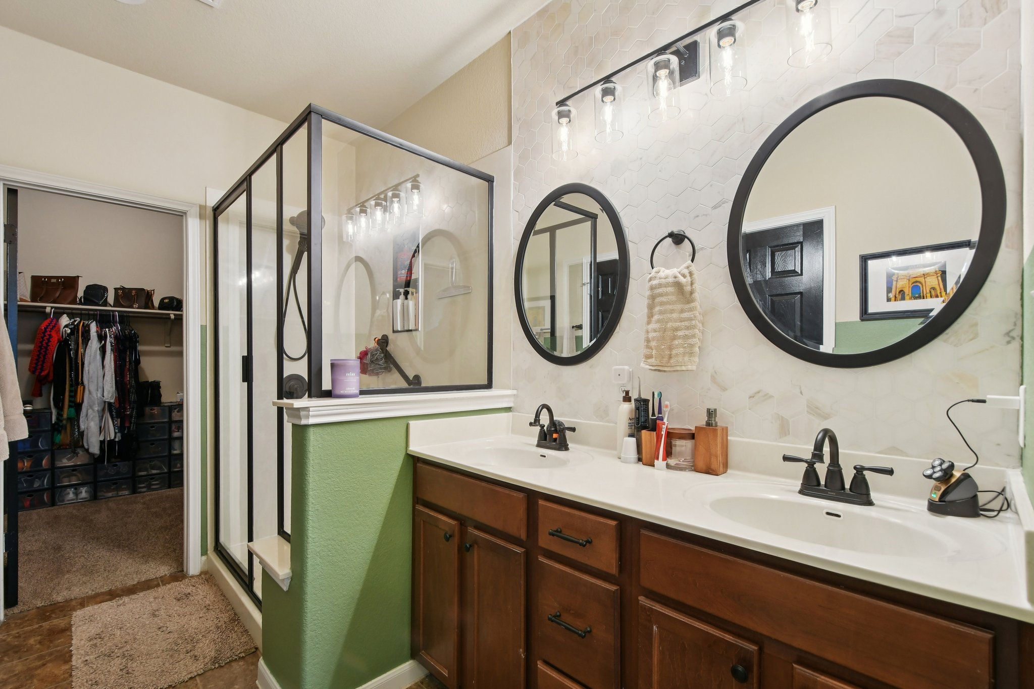 616 Lookout Tree Lane Round Rock, TX 78664 - Photo 12 of 39 Bathroom with a stall shower, a spacious closet, and double vanity