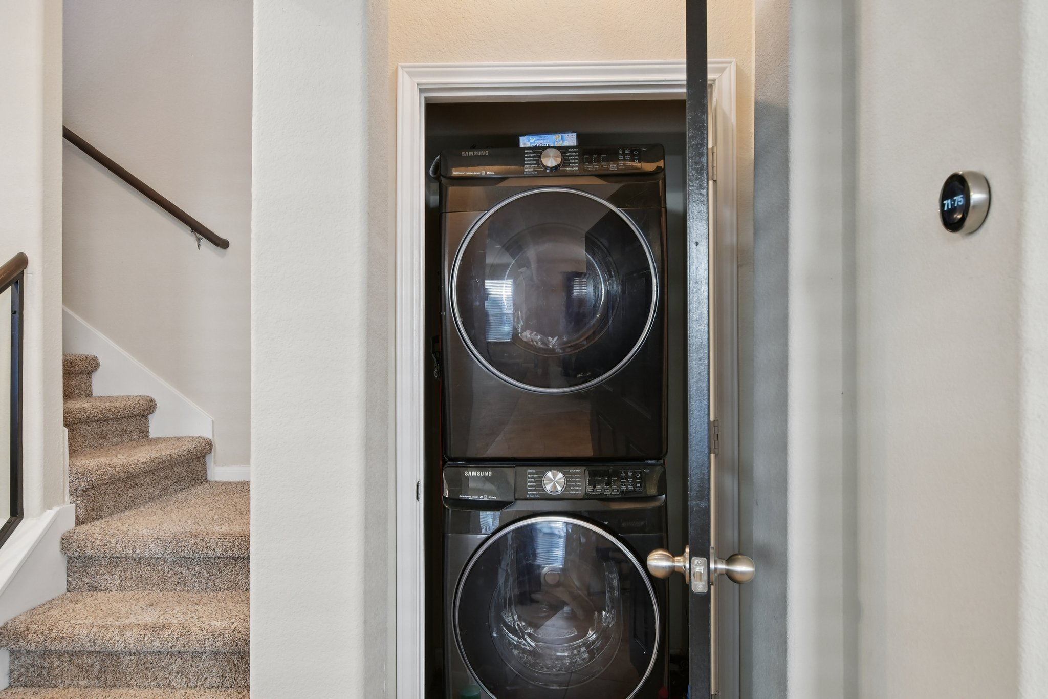616 Lookout Tree Lane Round Rock, TX 78664 - Photo 15 of 39 Laundry area featuring stacked washer and clothes dryer