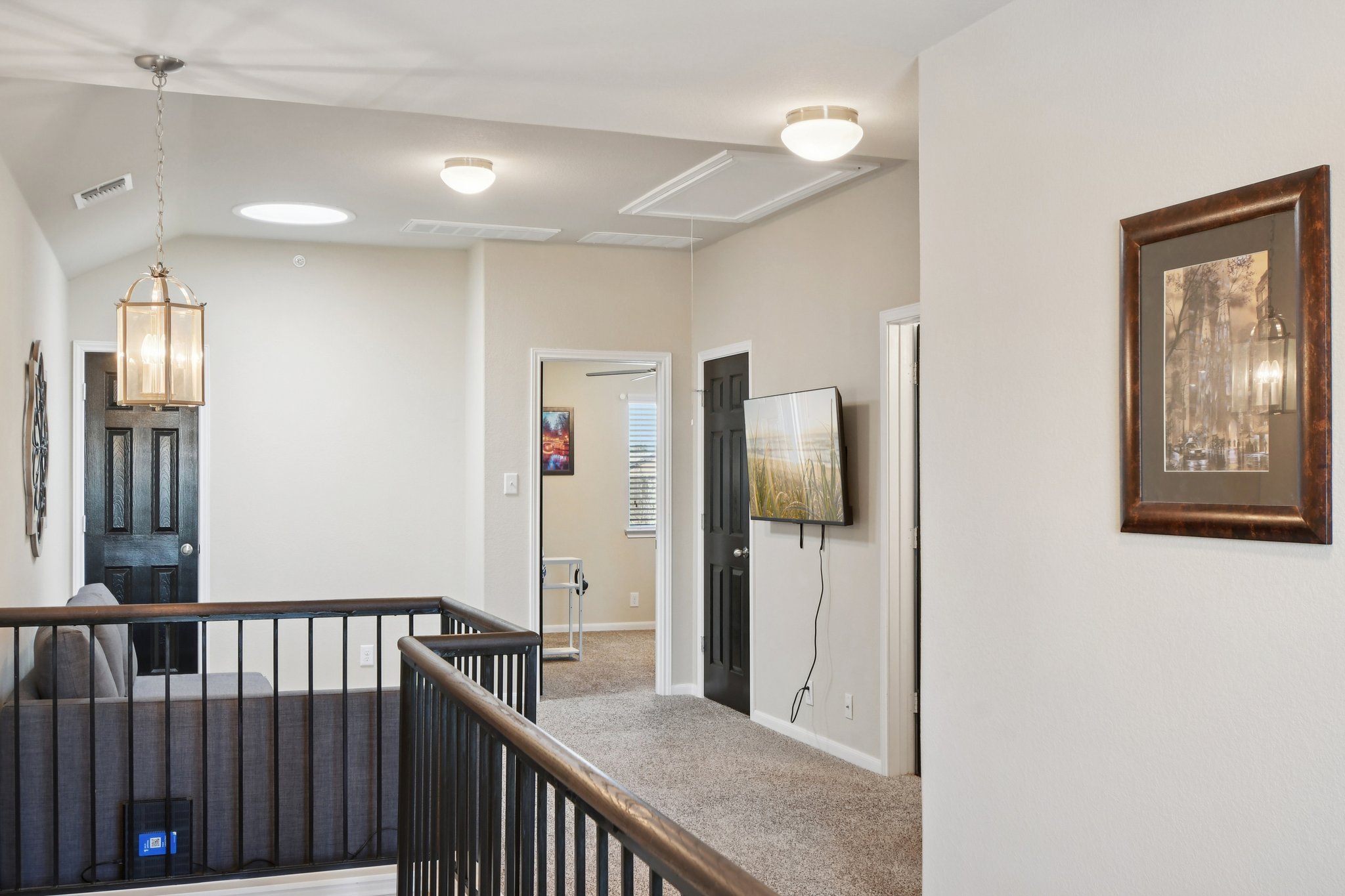 616 Lookout Tree Lane Round Rock, TX 78664 - Photo 16 of 39 Corridor with vaulted ceiling, an upstairs landing, and carpet flooring