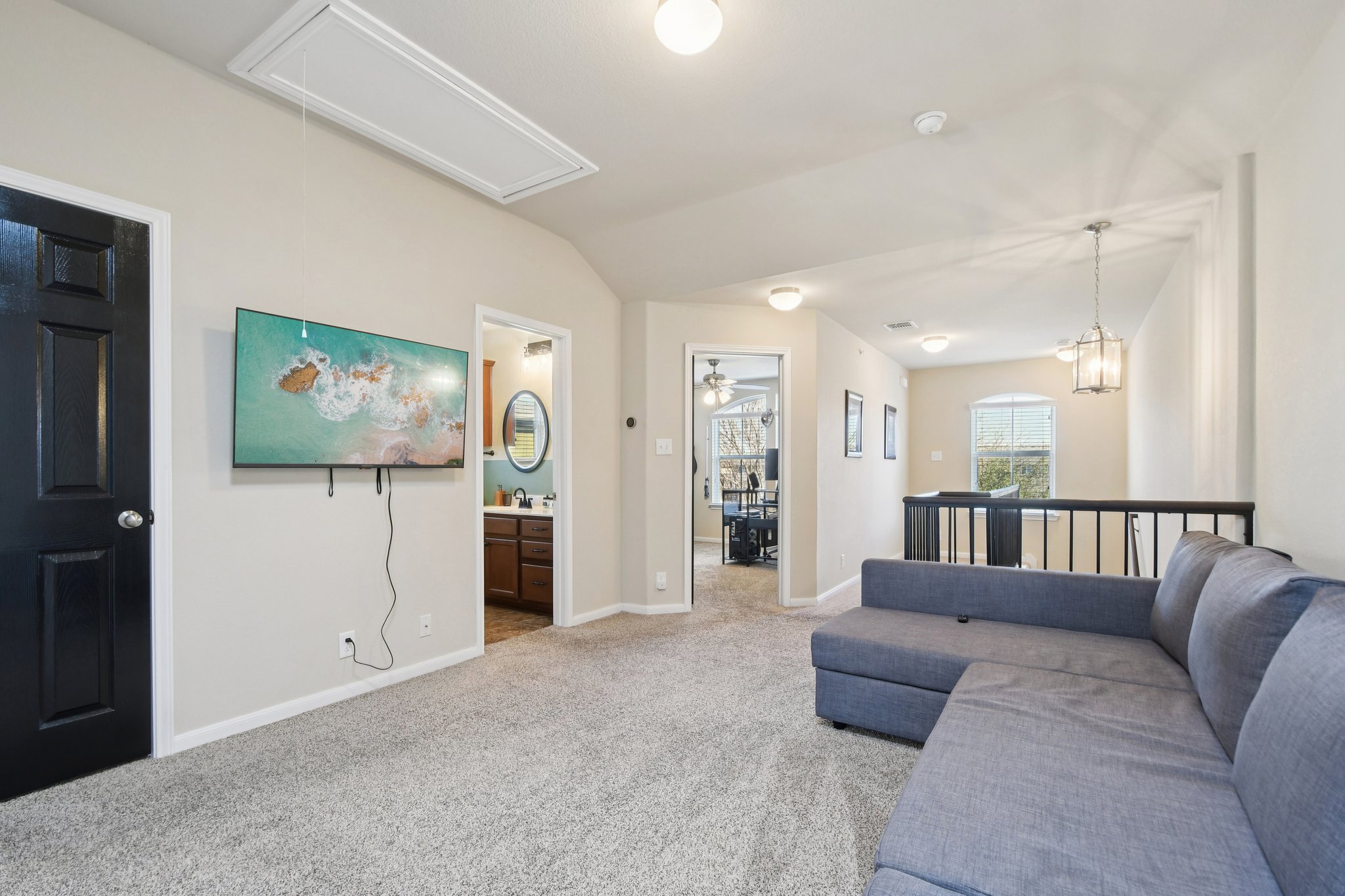 616 Lookout Tree Lane Round Rock, TX 78664 - Photo 17 of 39 Living room with carpet floors and vaulted ceiling