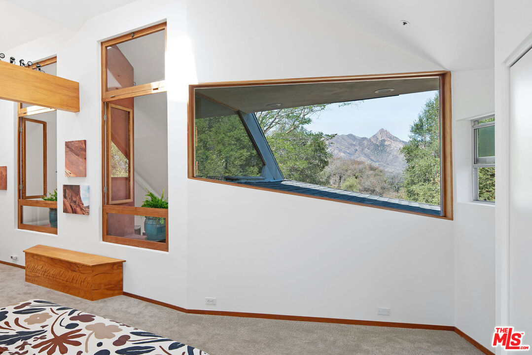 25830 Piuma Road Calabasas, CA 91302 - Photo 18 of 34 a living room with furniture and a window