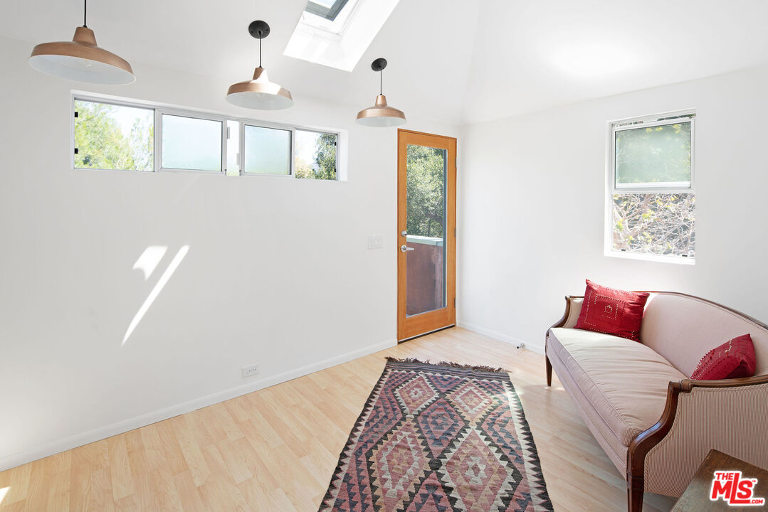 25830 Piuma Road Calabasas, CA 91302 - Photo 22 of 34 a bedroom with bed and a window