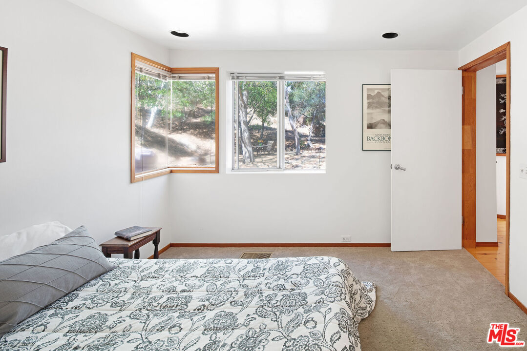 25830 Piuma Road Calabasas, CA 91302 - Photo 24 of 34 a bedroom with a bed and a window