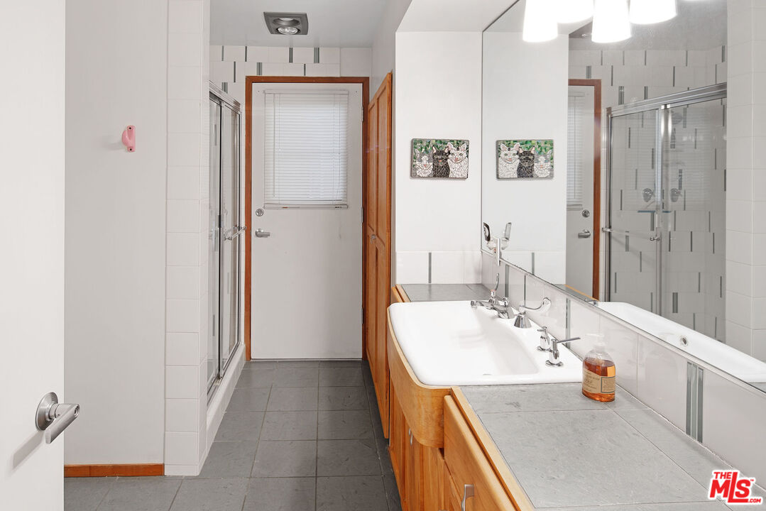 25830 Piuma Road Calabasas, CA 91302 - Photo 25 of 34 a bathroom with a sink and a mirror