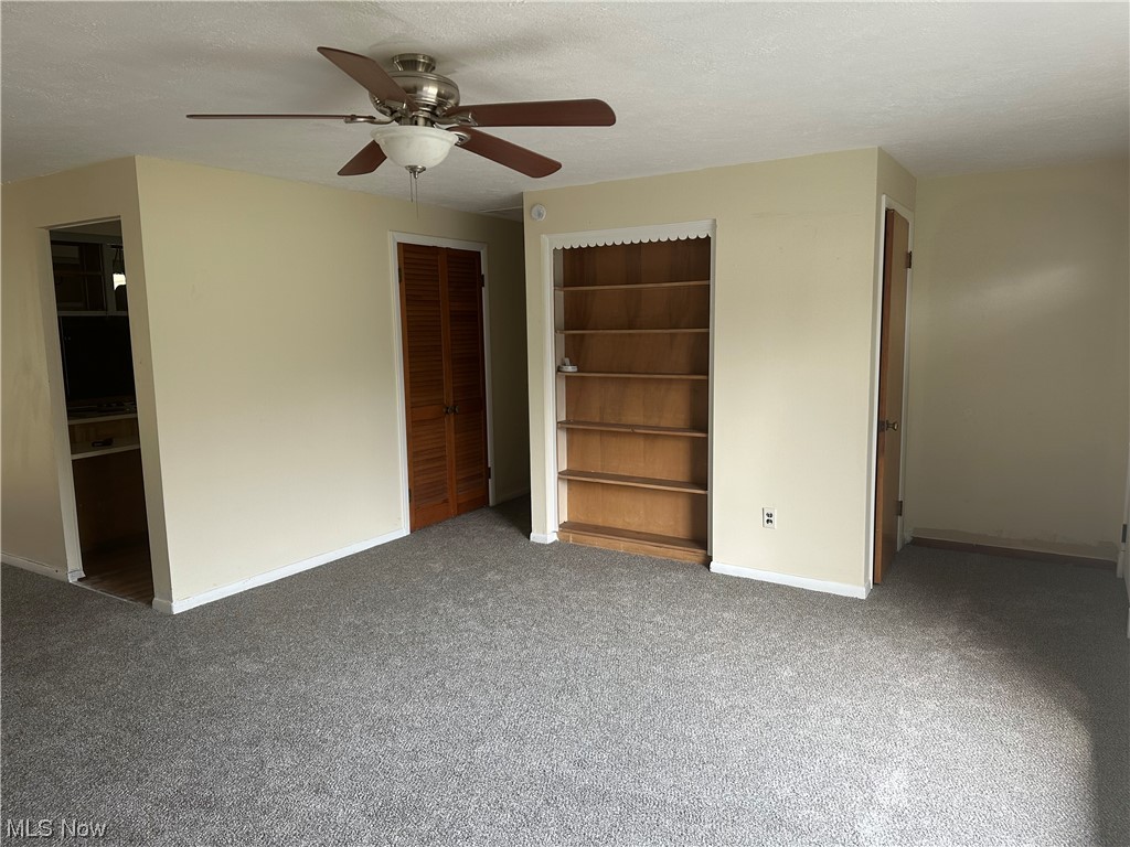 4410 Lane Road Painesville, OH 44077 - Photo 9 of 30 Livingroom featuring carpet and ceiling fan
