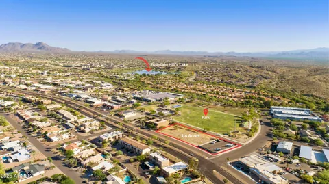 an aerial view of residential building with parking space