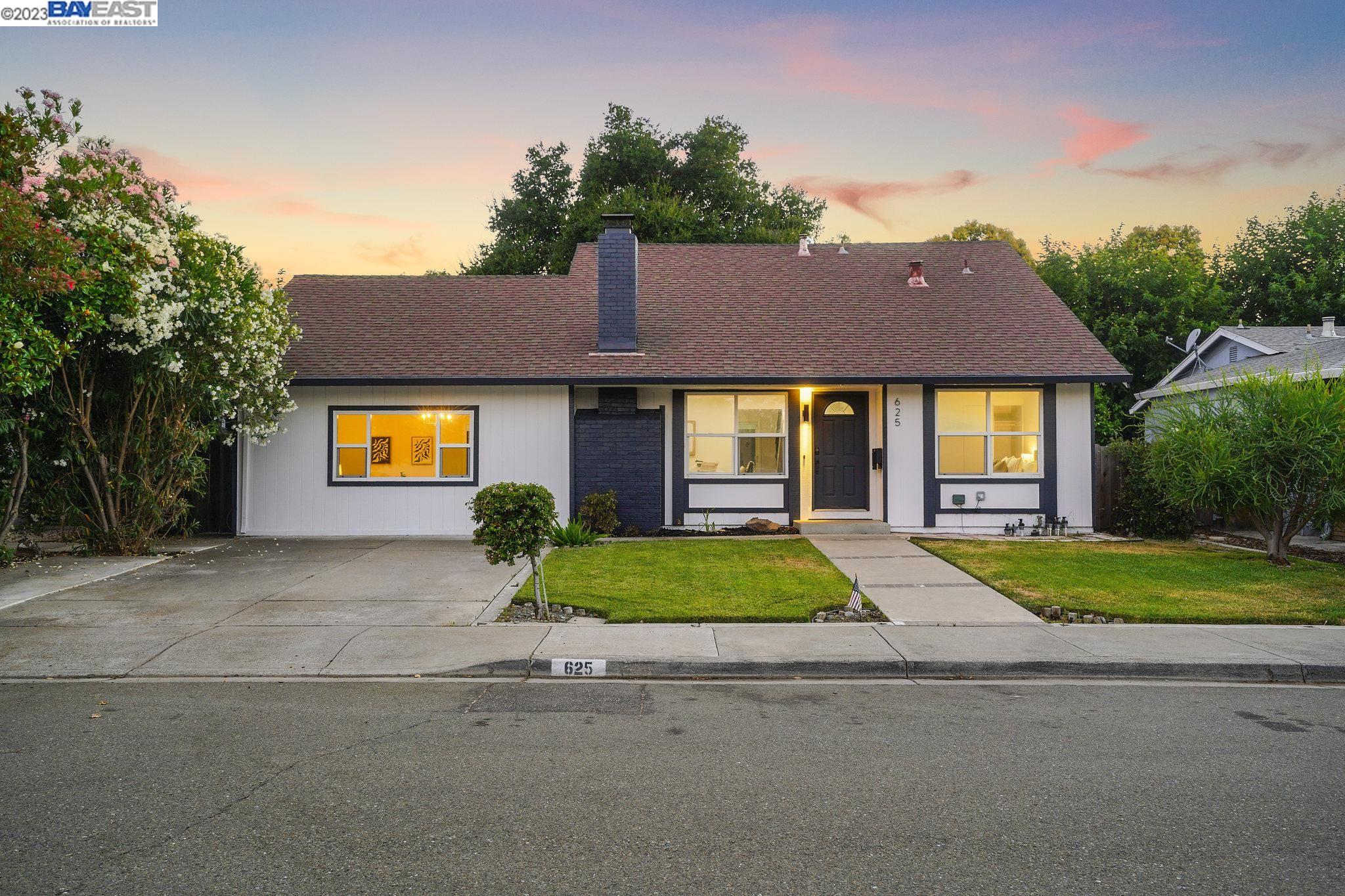 625 Bethal Place Livermore, CA 94551 - Photo 1 of 1 a front view of a house with a yard and garage