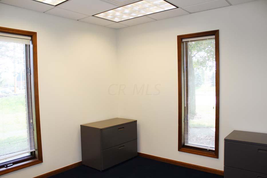 1900 Bethel Road Columbus, OH 43235 - Photo 20 of 24 New blue carpet ~02. Ivory painted walls. Suspended ceiling. Fluorescent lighting.