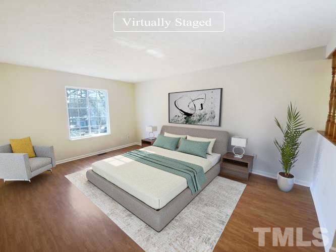 2508 Torbay Court Raleigh, NC 27613 - Photo 3 of 18 a bedroom with a large bed and a couch