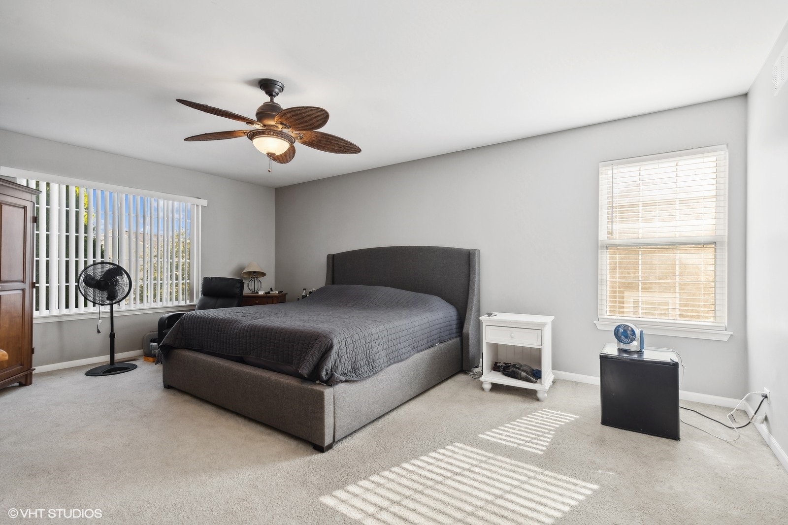 9740 Newton Road Huntley, IL 60142 - Photo 18 of 20 a bedroom with a bed and a chandelier