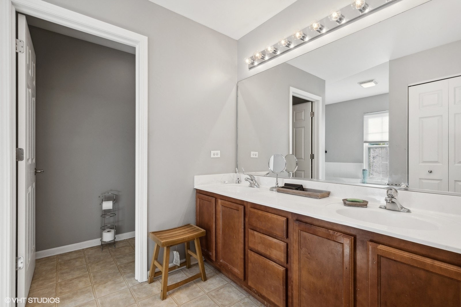 9740 Newton Road Huntley, IL 60142 - Photo 19 of 20 a bathroom with a double vanity sink and a mirror