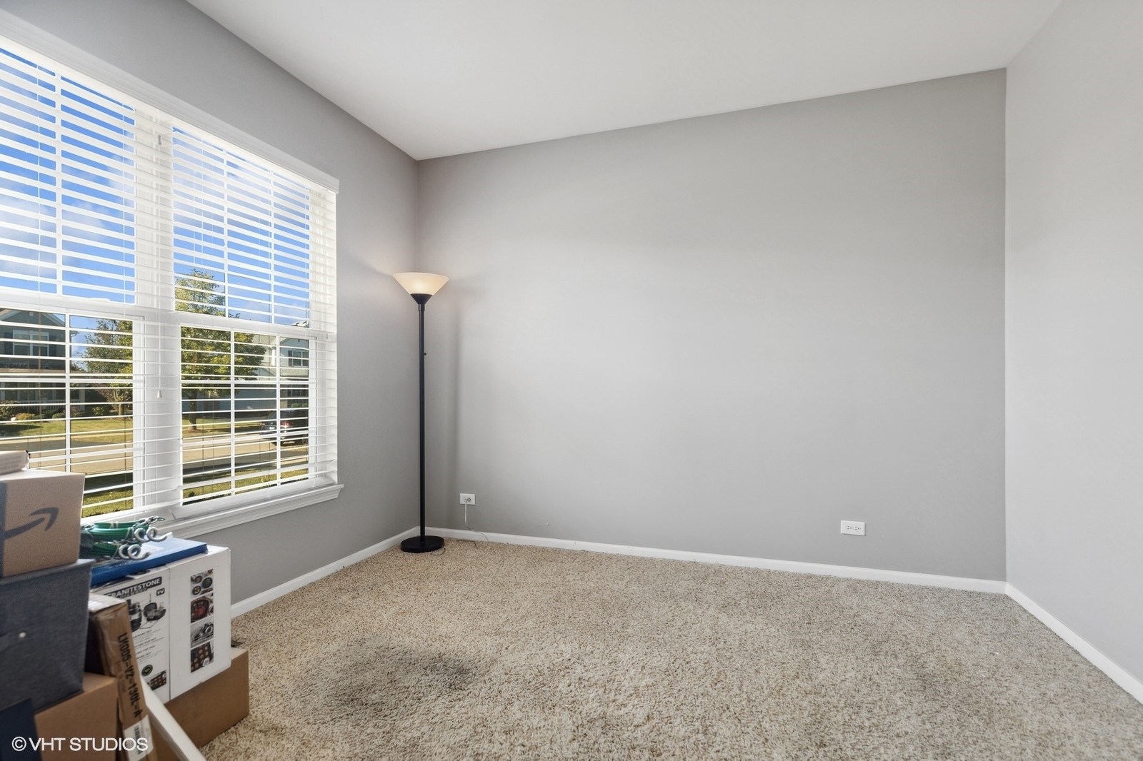 9740 Newton Road Huntley, IL 60142 - Photo 5 of 20 a view of an empty room with a window