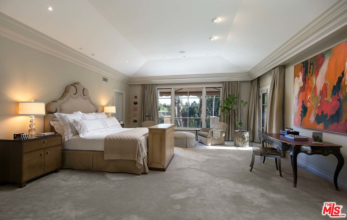 531 Barnaby Road Los Angeles, CA 90077 - Photo 13 of 28 a living room with furniture a large window and a flat screen tv