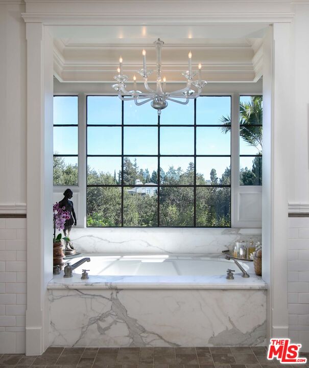 531 Barnaby Road Los Angeles, CA 90077 - Photo 15 of 28 a view of a bathroom with a tub and large window