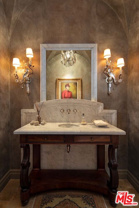 531 Barnaby Road Los Angeles, CA 90077 - Photo 20 of 28 a bathroom with a sink and a mirror