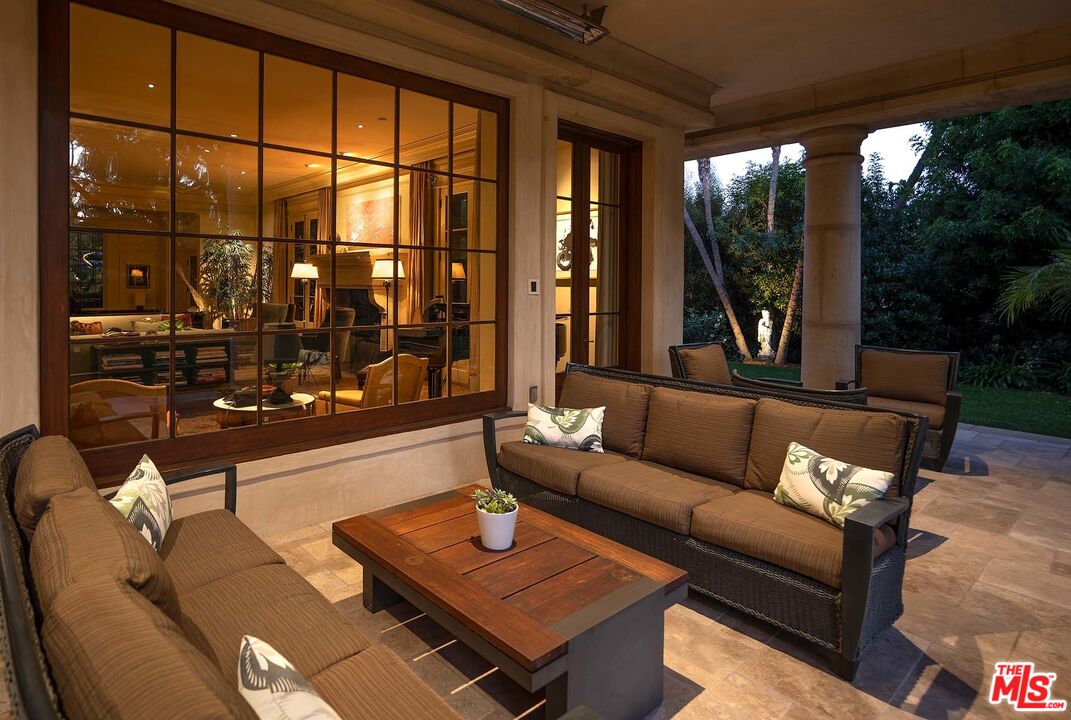 531 Barnaby Road Los Angeles, CA 90077 - Photo 21 of 28 a living room with furniture and a floor to ceiling window