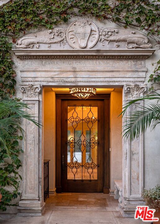 531 Barnaby Road Los Angeles, CA 90077 - Photo 9 of 28 a view of a fireplace with a potted plant