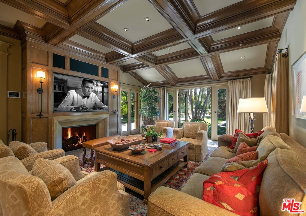 531 Barnaby Road Los Angeles, CA 90077 - Photo 10 of 28 a living room with furniture fireplace and a large window