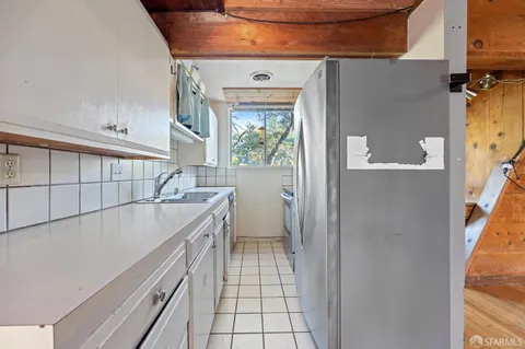 a bathroom with a sink a mirror and a shower