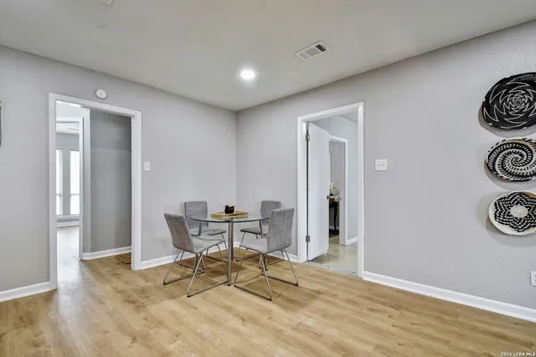 a view of a room with a table and chairs