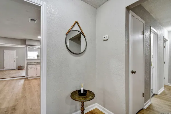 a view of a livingroom with furniture and a fan