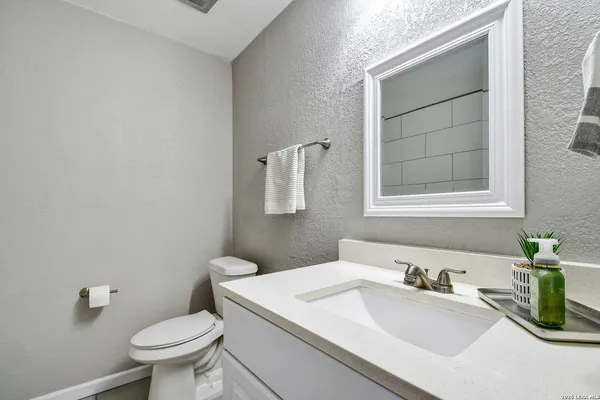 a bathroom with a sink and a toilet