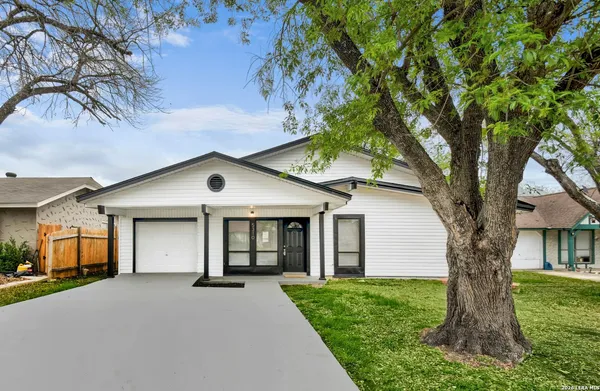 a house with a tree in front of it