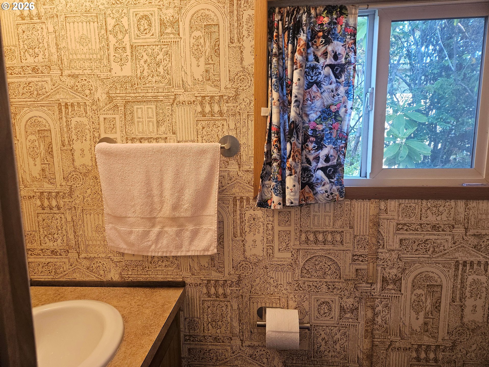 1600 Rhododendron Drive, Unit 214 Florence, OR 97439 - Photo 5 of 38 a bathroom with a toilet and a sink