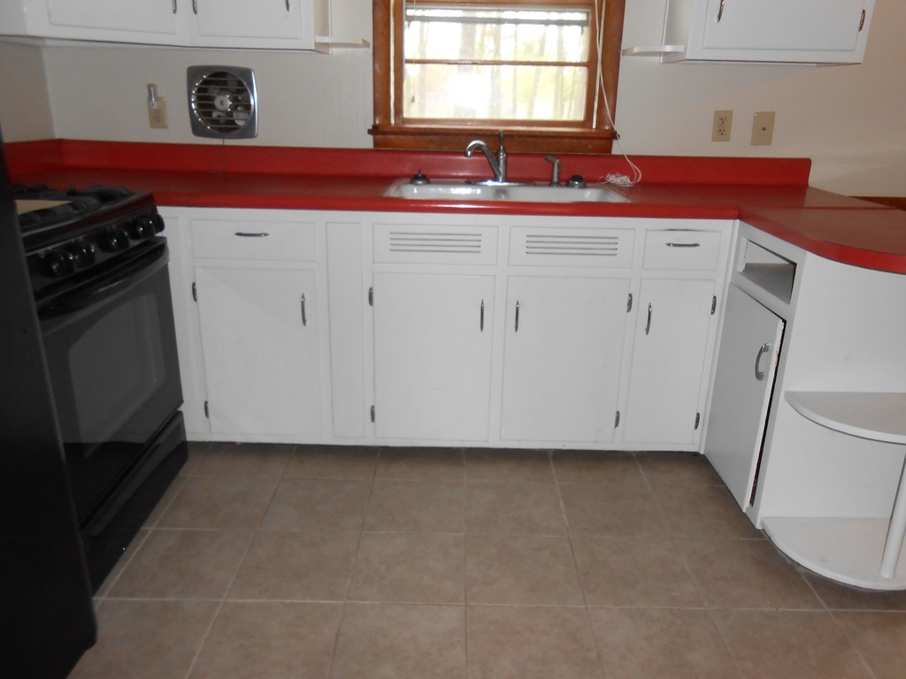 16 Varney Street Springfield, MA 01108 - Photo 5 of 6 a kitchen with a sink cabinets and a window