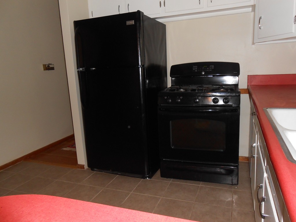 16 Varney Street Springfield, MA 01108 - Photo 6 of 6 a kitchen with a refrigerator and a stove