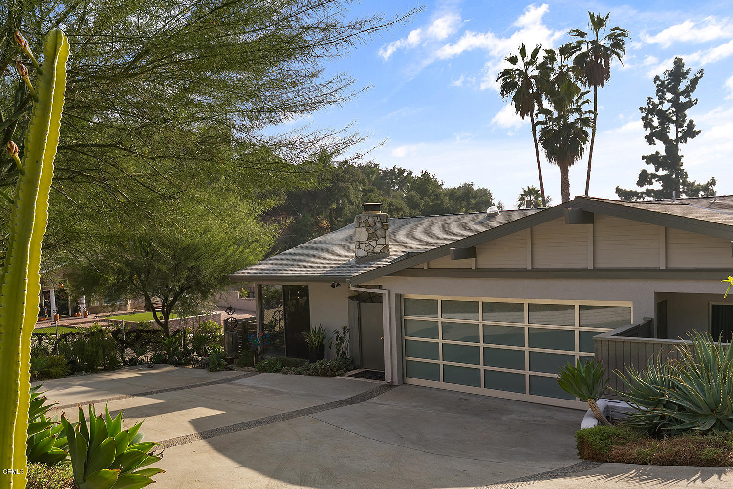 2044 Cricklewood Path Pasadena, CA 91107 - Photo 2 of 32 a front view of a house with a yard and garage