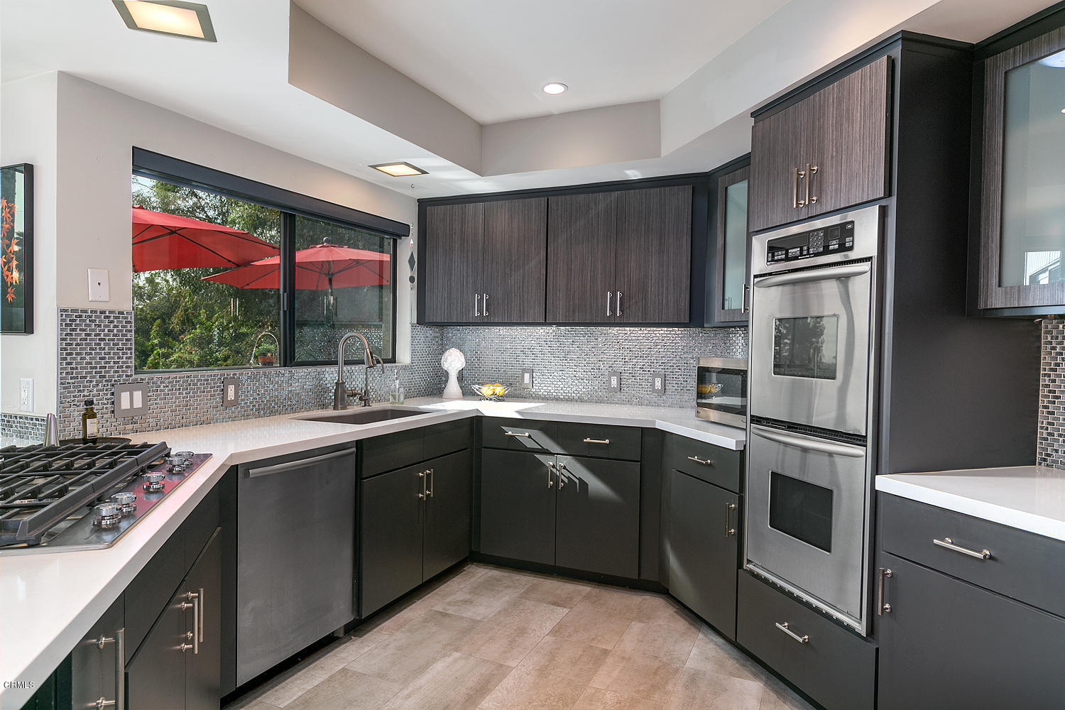 2044 Cricklewood Path Pasadena, CA 91107 - Photo 12 of 32 a kitchen with stainless steel appliances granite countertop a sink stove and refrigerator