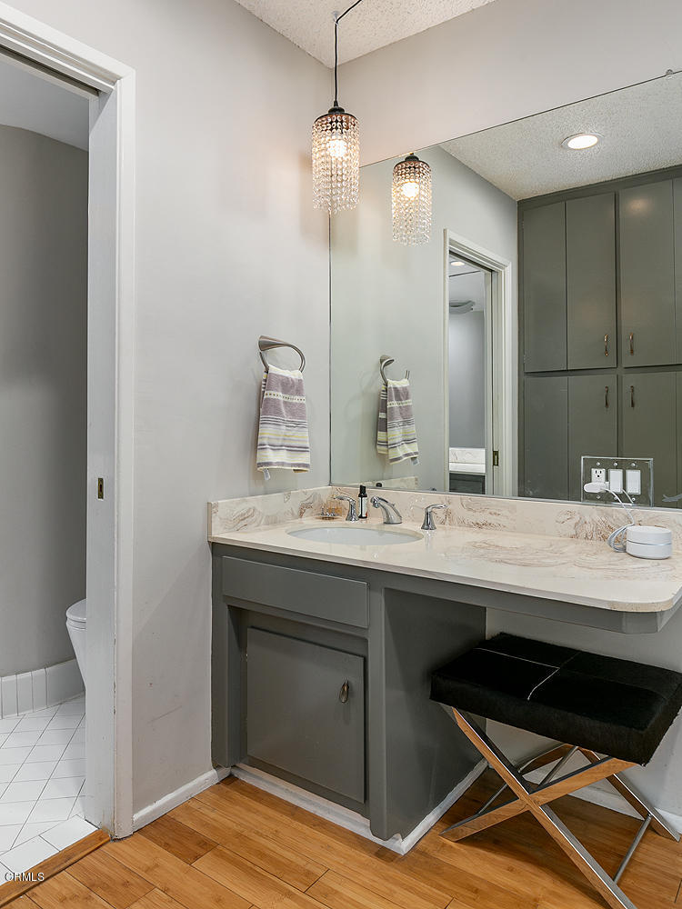 2044 Cricklewood Path Pasadena, CA 91107 - Photo 14 of 32 a bathroom with a sink and a mirror