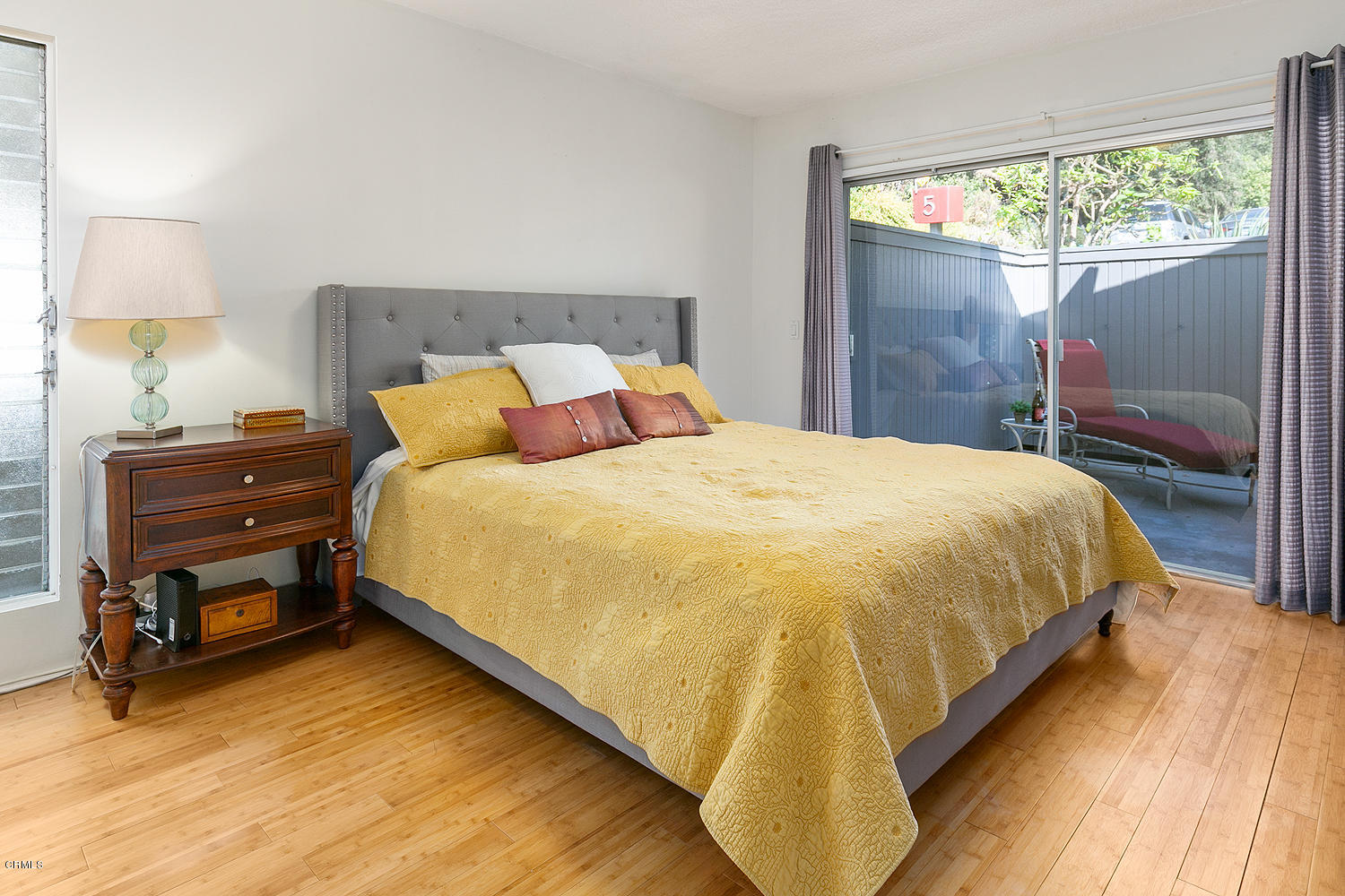 2044 Cricklewood Path Pasadena, CA 91107 - Photo 16 of 32 a bedroom with a bed and a lamp