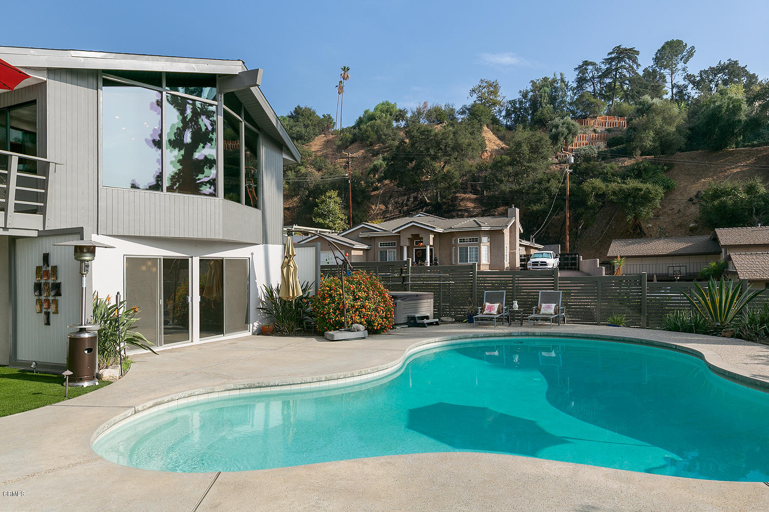 2044 Cricklewood Path Pasadena, CA 91107 - Photo 27 of 32 a view of a house with a swimming pool and sitting area