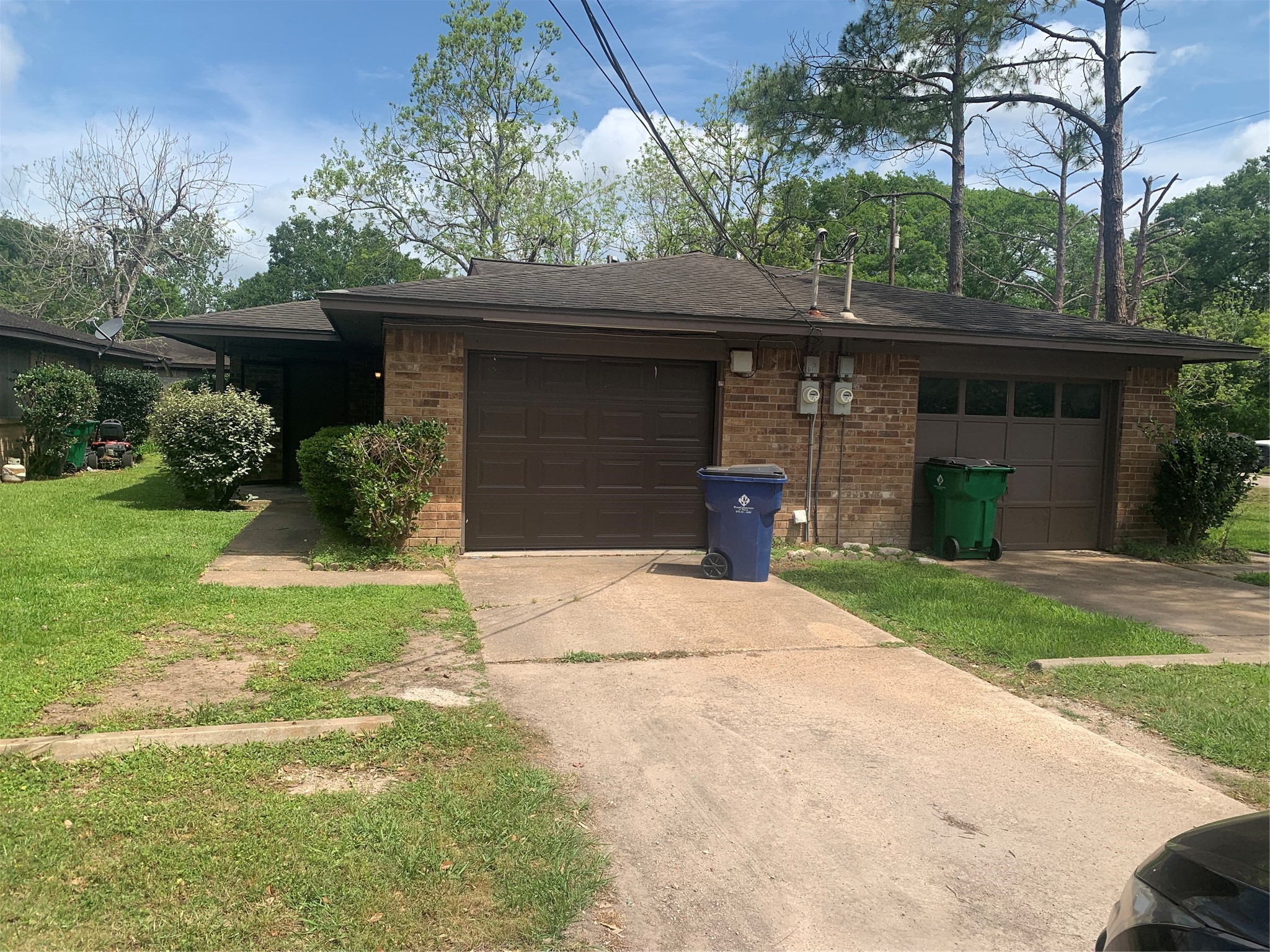 a front view of house with green space