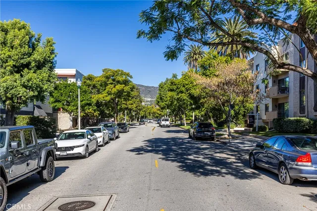 a view of a street with cars