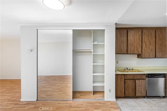 a kitchen with a refrigerator and cabinets
