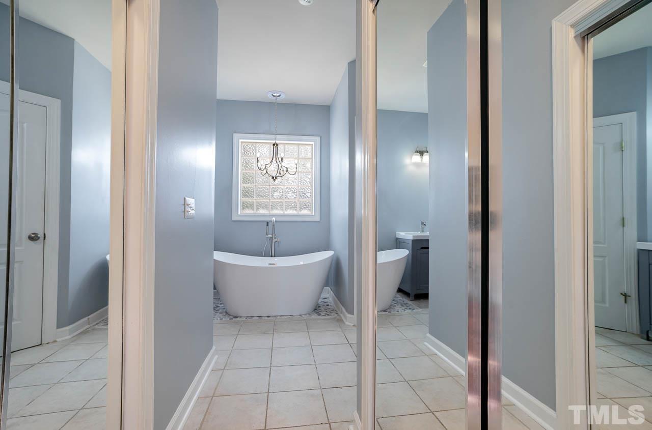 10204 Rosebank Lane Raleigh, NC 27614 - Photo 26 of 40 New Tub, paint, updated cabinets, new fixtures. Shower is being retiled and will be complete before closing