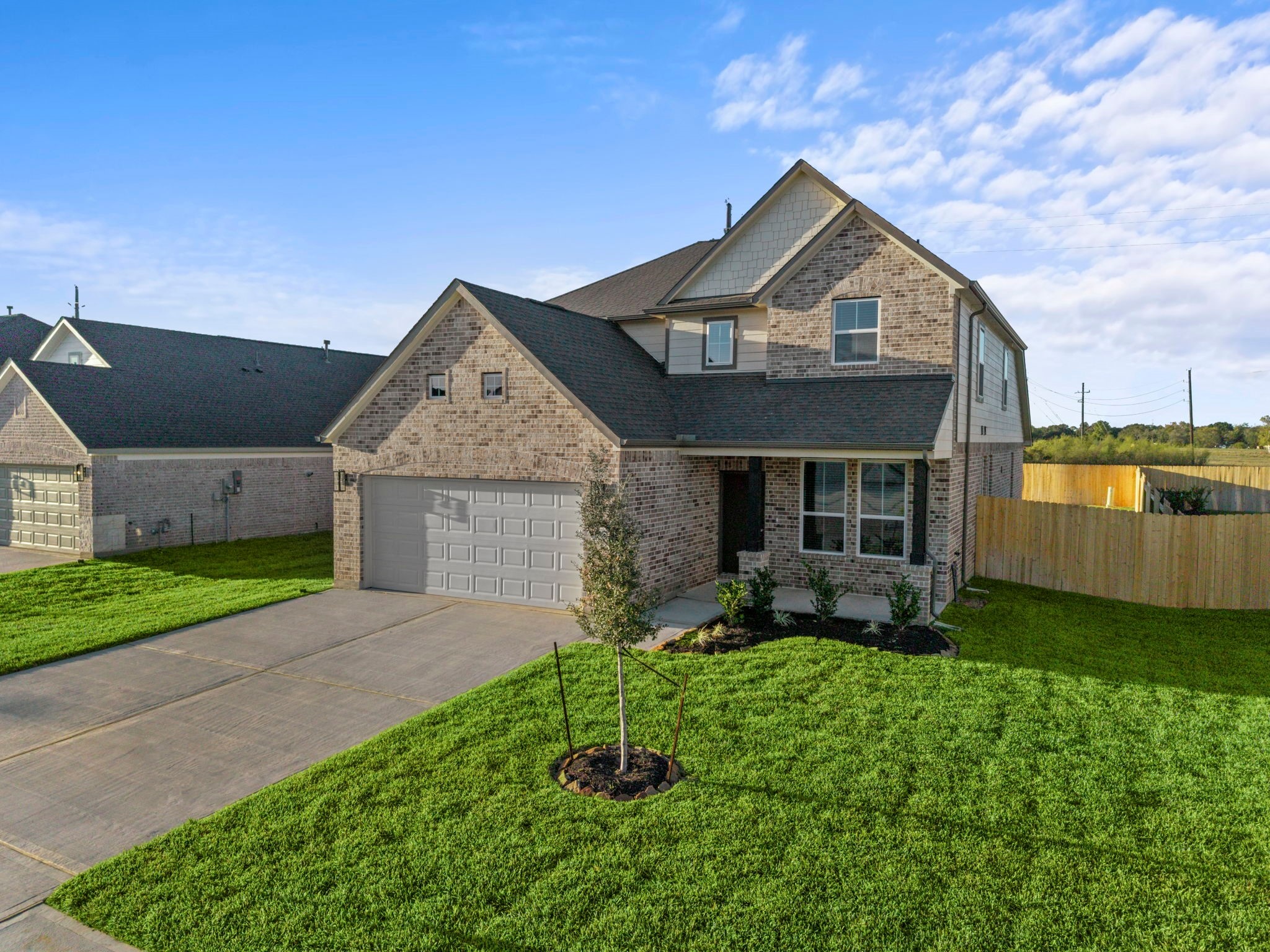 3102 Boulder Ridge Drive Rosenberg, TX 77471 - Photo 2 of 47 a front view of a house with a yard and garage
