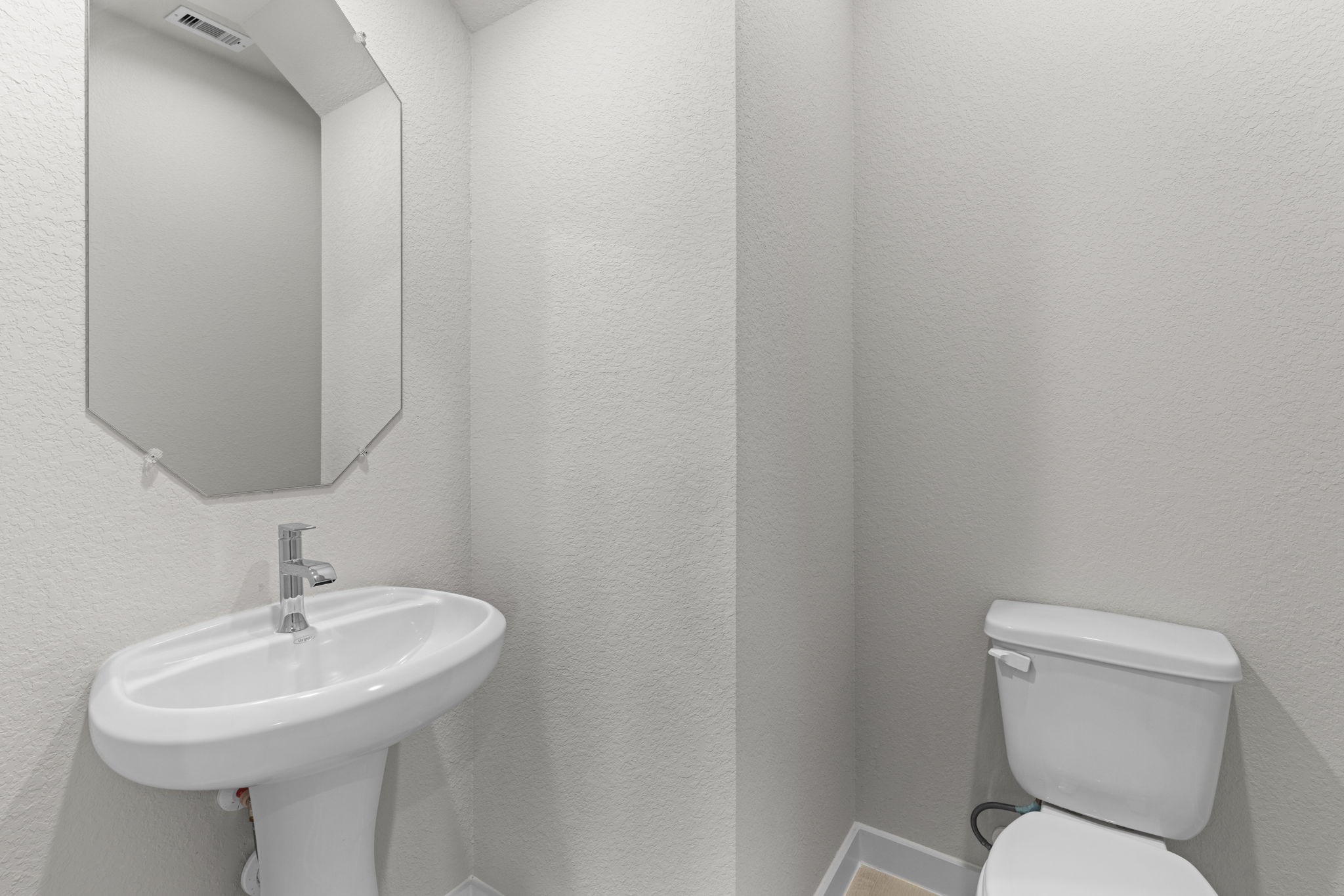 3102 Boulder Ridge Drive Rosenberg, TX 77471 - Photo 23 of 47 a bathroom with a toilet sink and mirror