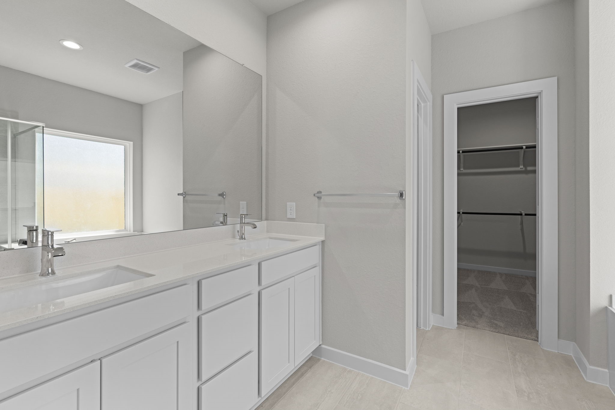 3102 Boulder Ridge Drive Rosenberg, TX 77471 - Photo 29 of 47 a bathroom with a double vanity sink and a mirror