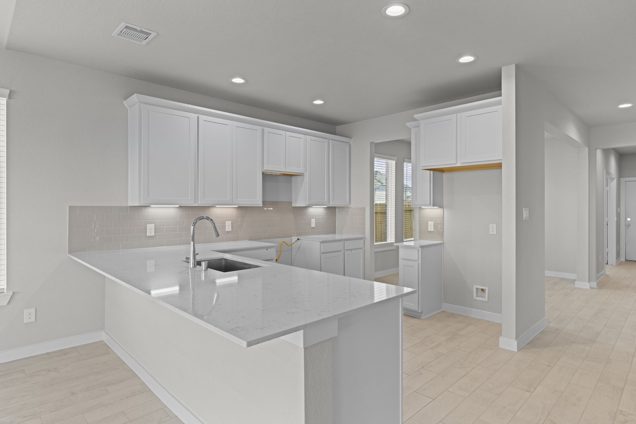 3102 Boulder Ridge Drive Rosenberg, TX 77471 - Photo 3 of 47 a kitchen that has a sink cabinets and stainless steel appliances