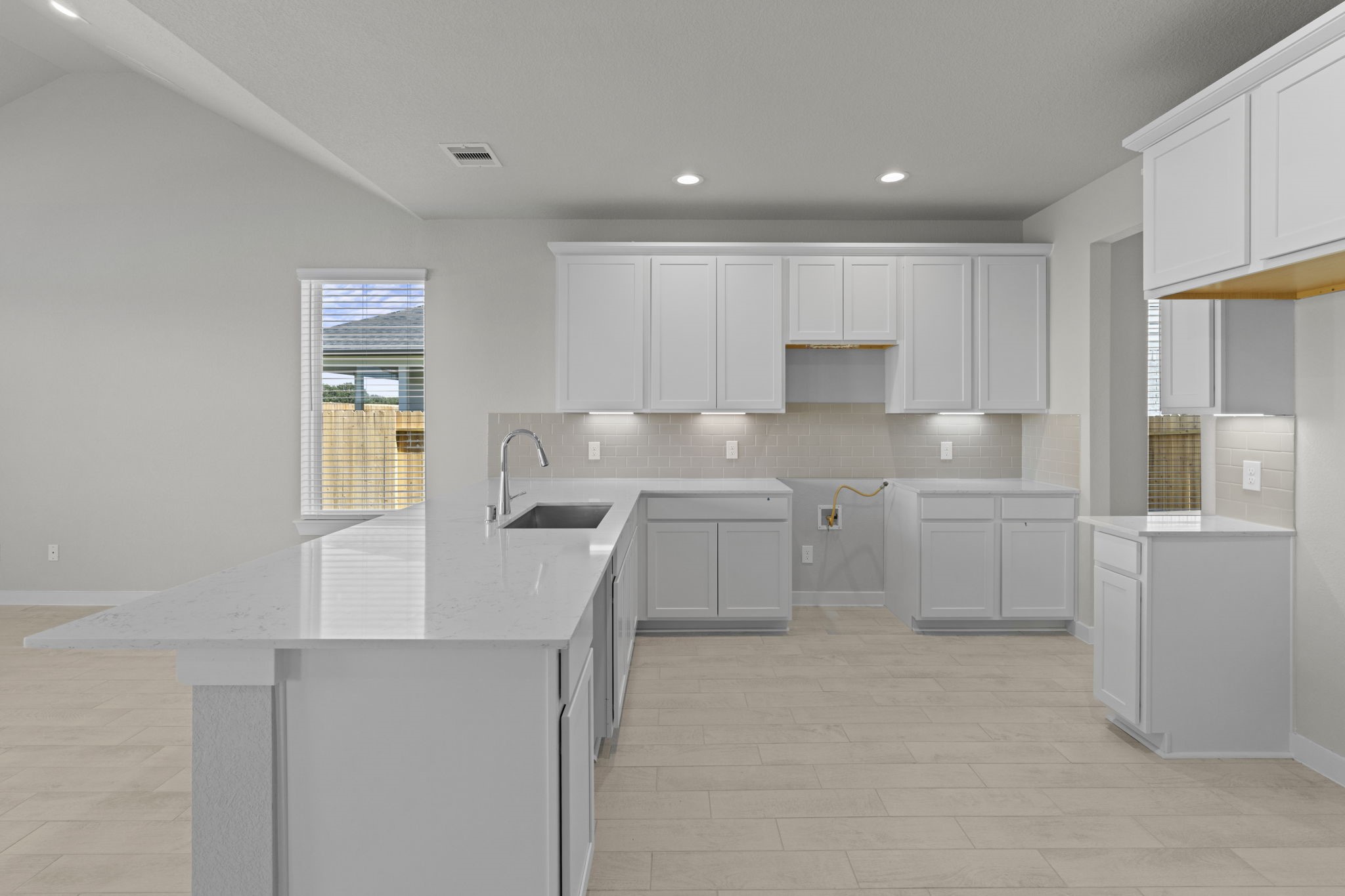 3102 Boulder Ridge Drive Rosenberg, TX 77471 - Photo 6 of 47 a kitchen with cabinets and window
